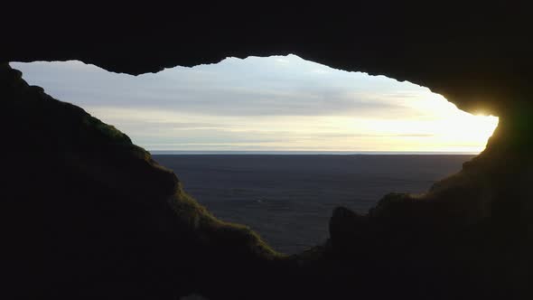 Setting Sun Shining Over Black Sand Beach alt