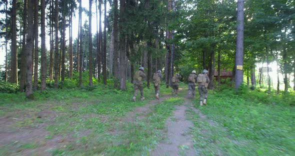 Soldiers Taking Aim From Rifle in Forest Smoke in Background Military and Army Concept alt