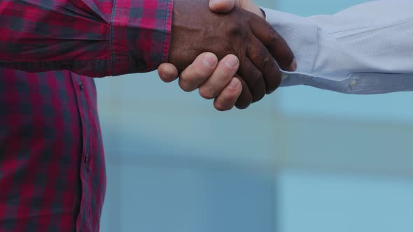 Closeup Part of Human Body Diverse Male Partners Shake Hands Conclude Successful Contract Agreement alt