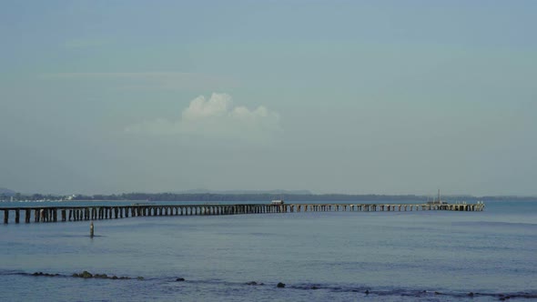 panning shot of Wooden bridge to the sea at Rayong,Thailand