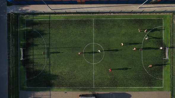 Top View of a Sports Soccer Field with People Playing Soccer.a Small Football Field on the Street in alt