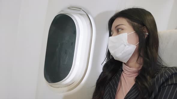 female passenger traveling by plane transportation during covid19 virus pandemic alt