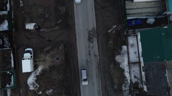 Top down Aerial view of cars drive on the spring road in the village 06 alt
