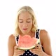 Beautiful woman eating watermelon