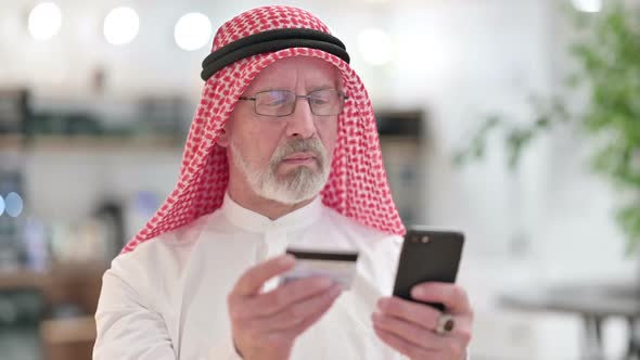 Online Payment Success on Smartphone By Old Arab Businessman alt