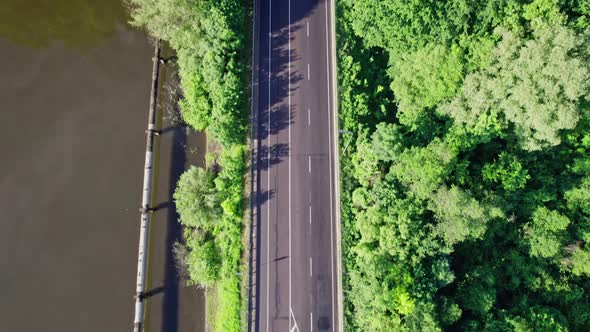 Car Riding on the Highway Through the Forest on Countryside alt