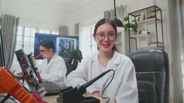 Woman Smiling Charmingly Looking At Camera. Young Intelligent Female Scientist Working In Office alt