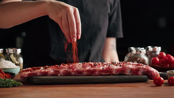 Woman Chef Cooking Ribs Closeup alt