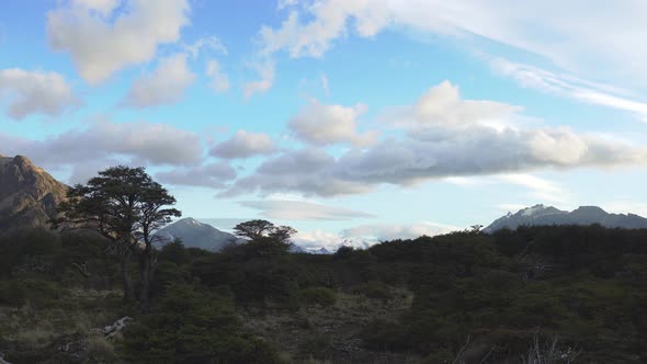 Clouds rolling over peaceful valley near Mount Fitz Roy in Patagonia Argentina alt