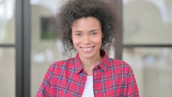 Portrait of African Woman Shaking Head As Yes Sign Approval alt