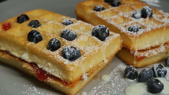 Delicious Golden Viennese Waffles with Blueberries Filled with Condensed Milk