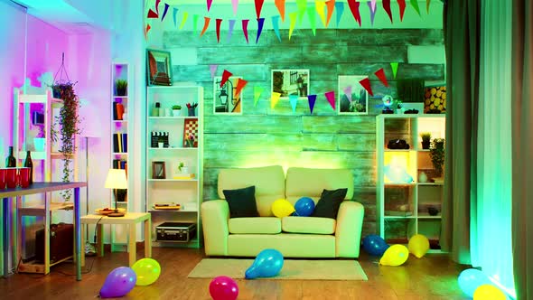 Party Decorated Room with Neon Lights on the Wall and a Disco Ball alt