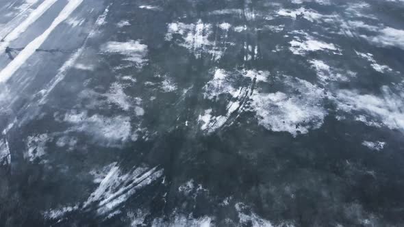 Aerial view of melting ice on the surface of the lake.