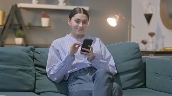 Portrait of Indian Woman Pointing at the Camera alt