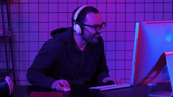 Evil Lough of Angry Gamer While Playing on the Computer. Emotional Gamer. alt