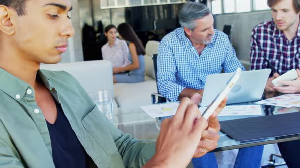 Executive using digital tablet in office 4k alt