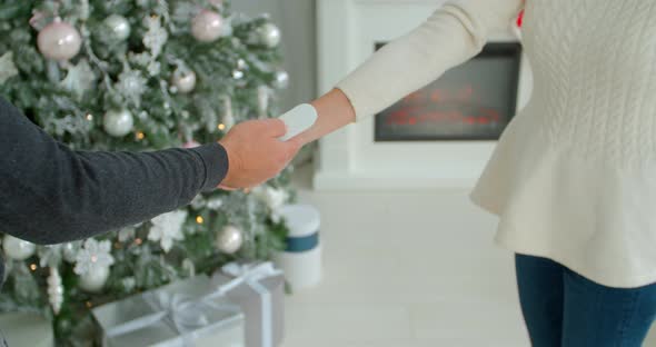 COVID-19 Body Temperature Measuring for Coronavirus. A Woman's Temperature Is Taken for Controlling alt