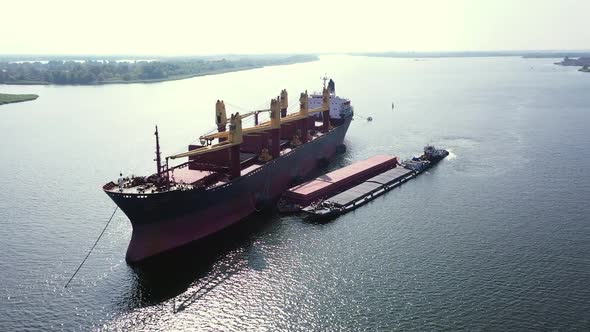 Slow Tracking Aerial of Cargo Bulker During Underway Ship to Ship Tranfer Operation alt