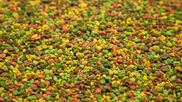Multicolored Granular Fish Food for Feeding
