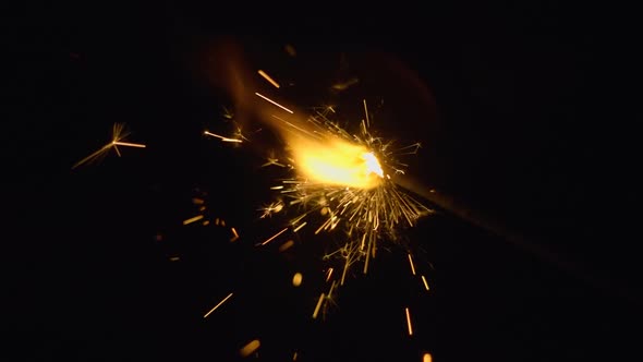 Sparks Of Sparkler Fly Around On A Black Background