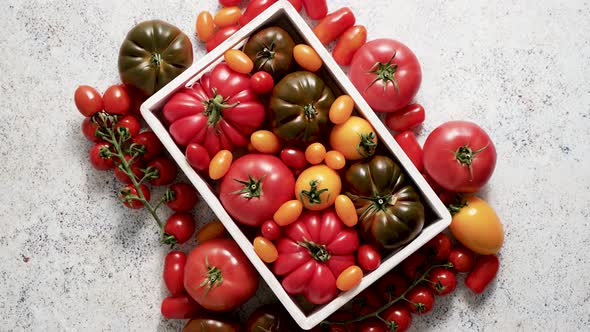 Assortment of Tomatoes in a Wooden Box