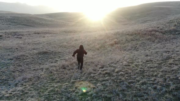 Child Runs To the Sun on an Autumn Hill