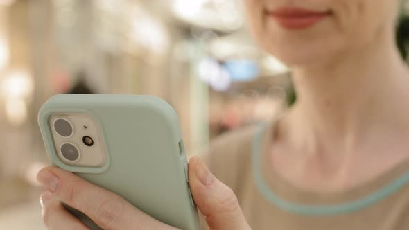 Closeup Female Hands Holding Mobile Phone Device Gadget Unrecognizable Caucasian Middle Aged Woman alt