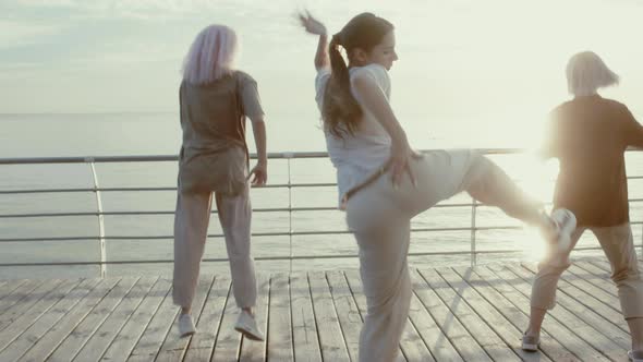 Dancing Group of Young Talented Freak Women Performing Freestyle Hip-hop Moves. Girls Enjoying alt