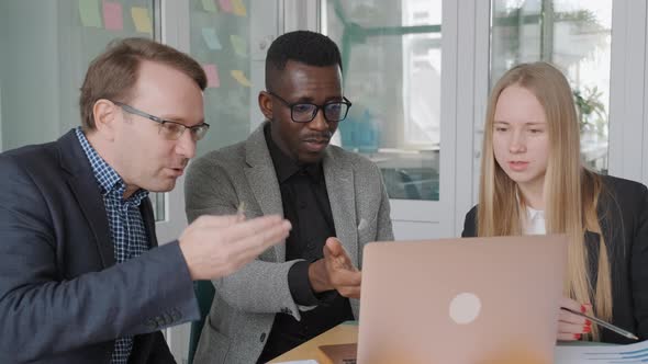 Diverse Team of Students Young Business Partners Discuss Their Startup Project