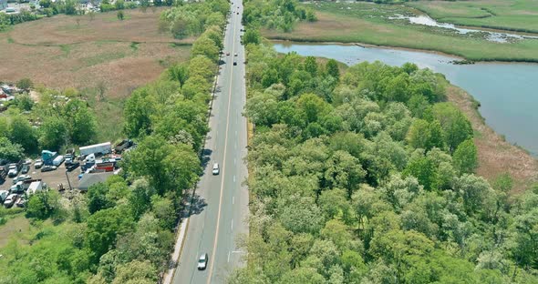 Aerial Beautiful View of Bridge Over the River with Traffic Moves Across the US Highway alt