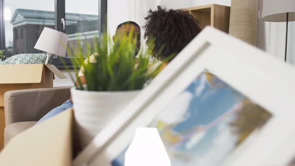Happy Couple with Tablet Pc Computer at New Home alt