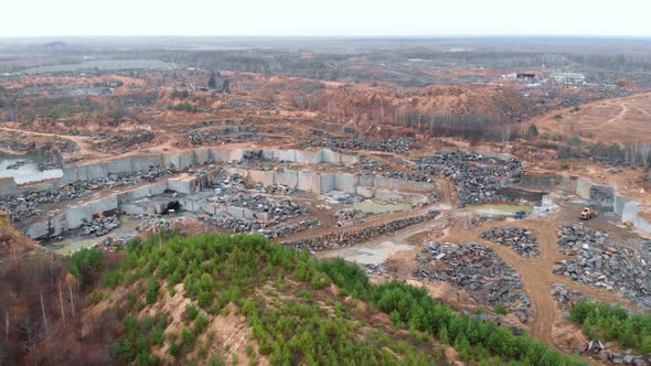 Opencast mining industry. Stone quarry. Granite mine. Iron granite quarry. Open pit mine quarry alt