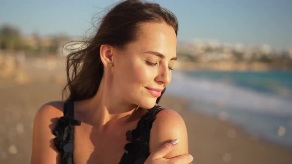 Portrait of Charming Confident Elegant Woman Posing Outdoors Admiring Beautiful Sunset Over Blue alt