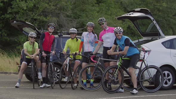 Group of cyclists pose for group photo.  Fully released for commercial use.