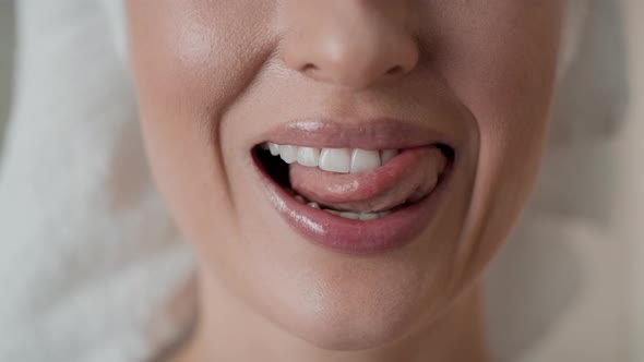 Close up video of woman showing full smile. Shot with RED helium camera in 8K. alt