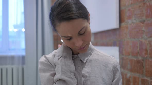 Tired Hispanic Woman at Work Trying to Relax alt