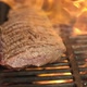 big juicy piece of raw meat  fried on a hot grill on an open flame. - VideoHive Item for Sale