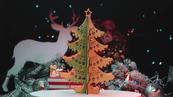 Spinning wooden tree on a Christmas background. Christmas holiday celebration tradition concept