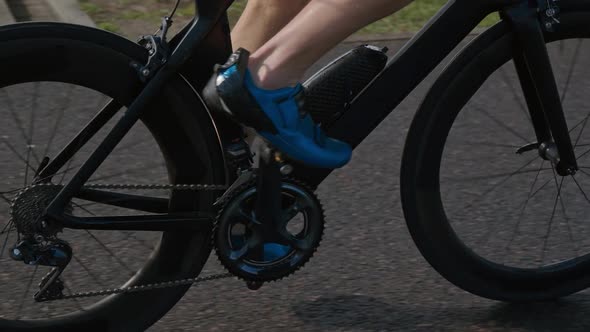 An Hardy Triathlete Rides a Bike Pro Cyclist Rides on the Road Athlete Trains on a Cutting Bike Slow alt