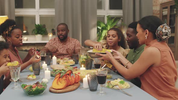 Big Afro-American Family Having Dinner Together alt