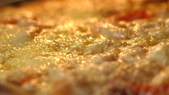 Cheese on Pizza Melts From Oven Heat alt