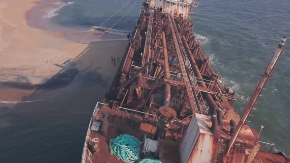 Shipwreck on a beach near Varkala in Kerala, India. Aaerial drone close up alt
