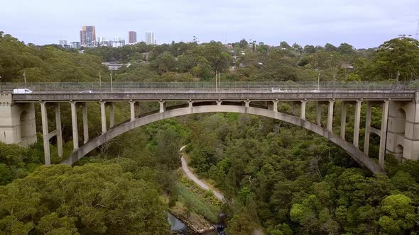 Long Gully Suspension Bridge in Northbridge, Sydney Australia, Aerial drone right side tracking shot alt