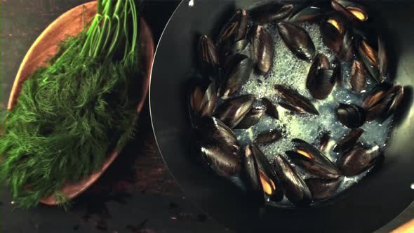 Super Slow Motion in the Pan are Boiled Mussels with Air Bubbles alt