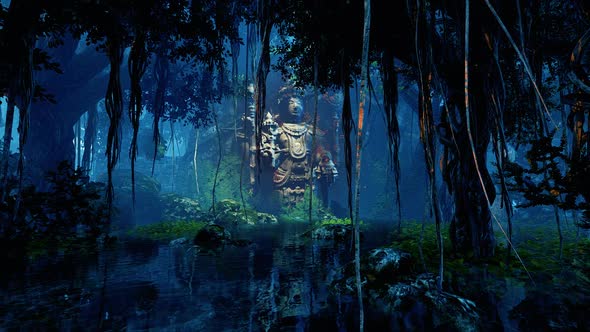 Ancient sculpture of a god in the jungle