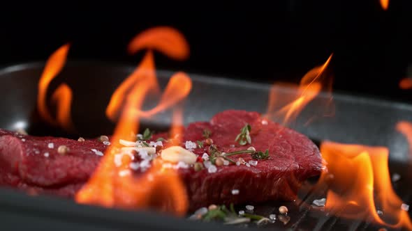 Super Slowmotion Footage of Flambe Fresh Beef Meat and Seasoning on Ignited Pan, 1000Fps  alt