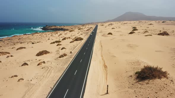 Winding Asphalt Road Across the Dunes of Corralejo Fuerteventura Canary Islands Spain alt