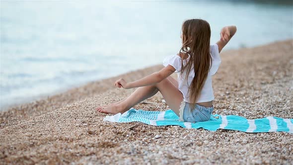 Cute Little Girl at Beach During Summer Vacation alt