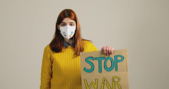 Ukrainian Girl with Mask Colored with Colors of Peace alt