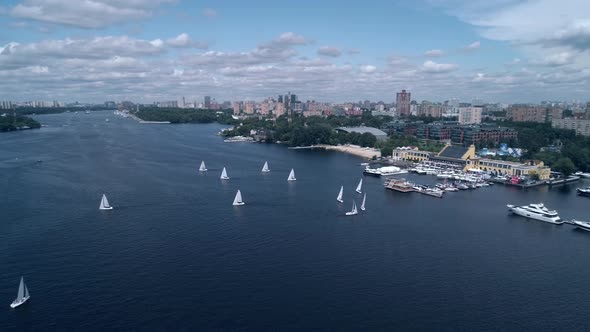 Breathtaking Aerial View of Yachts Race Across the River